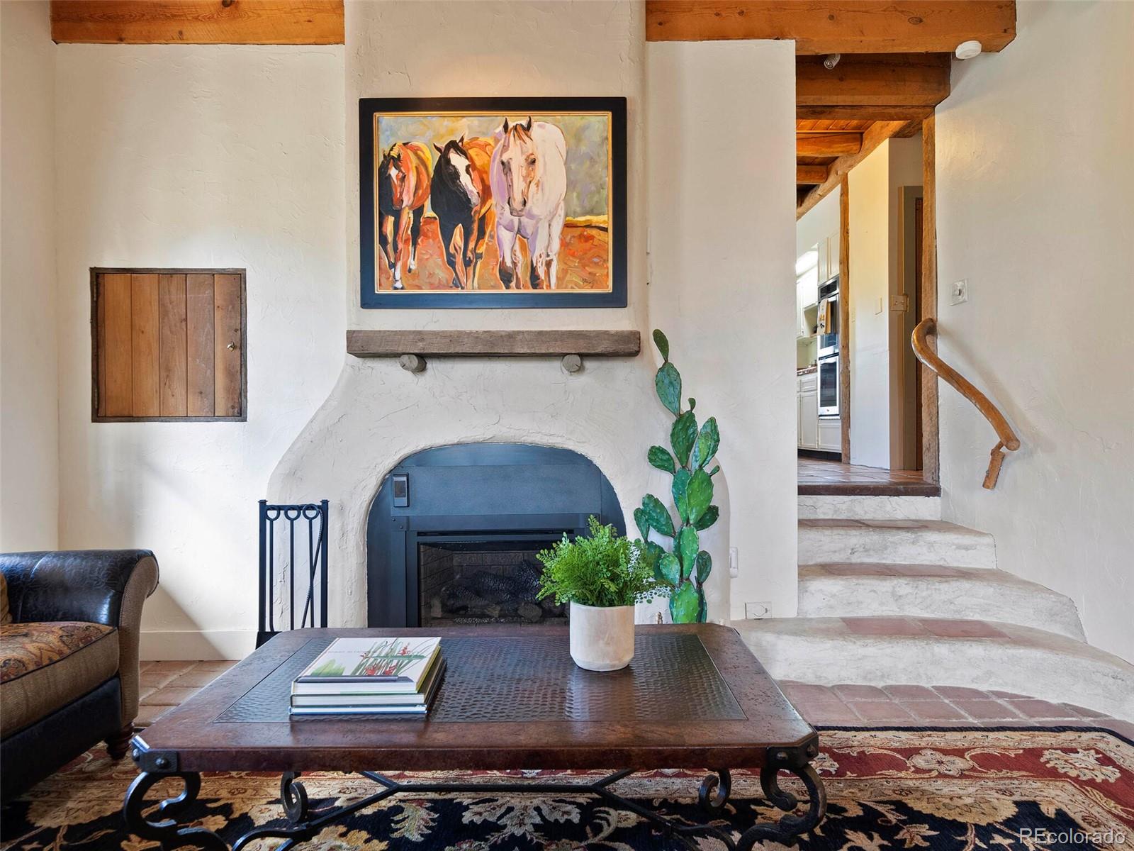 26795 Light Lane Conifer, CO 80433 - Photo 36 of 40 a living room with furniture and a fireplace
