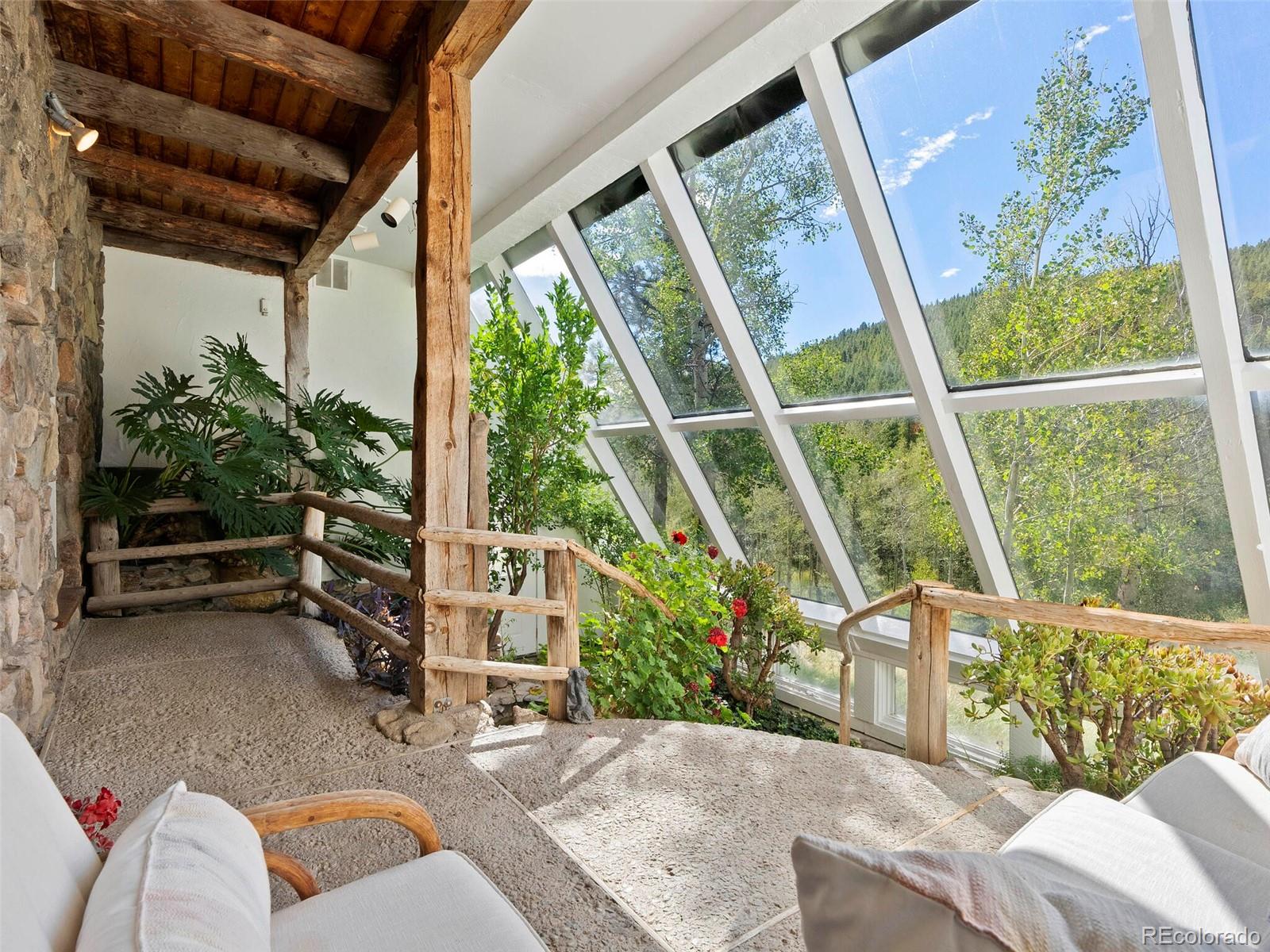 26795 Light Lane Conifer, CO 80433 - Photo 38 of 40 a living room with furniture and a potted plant