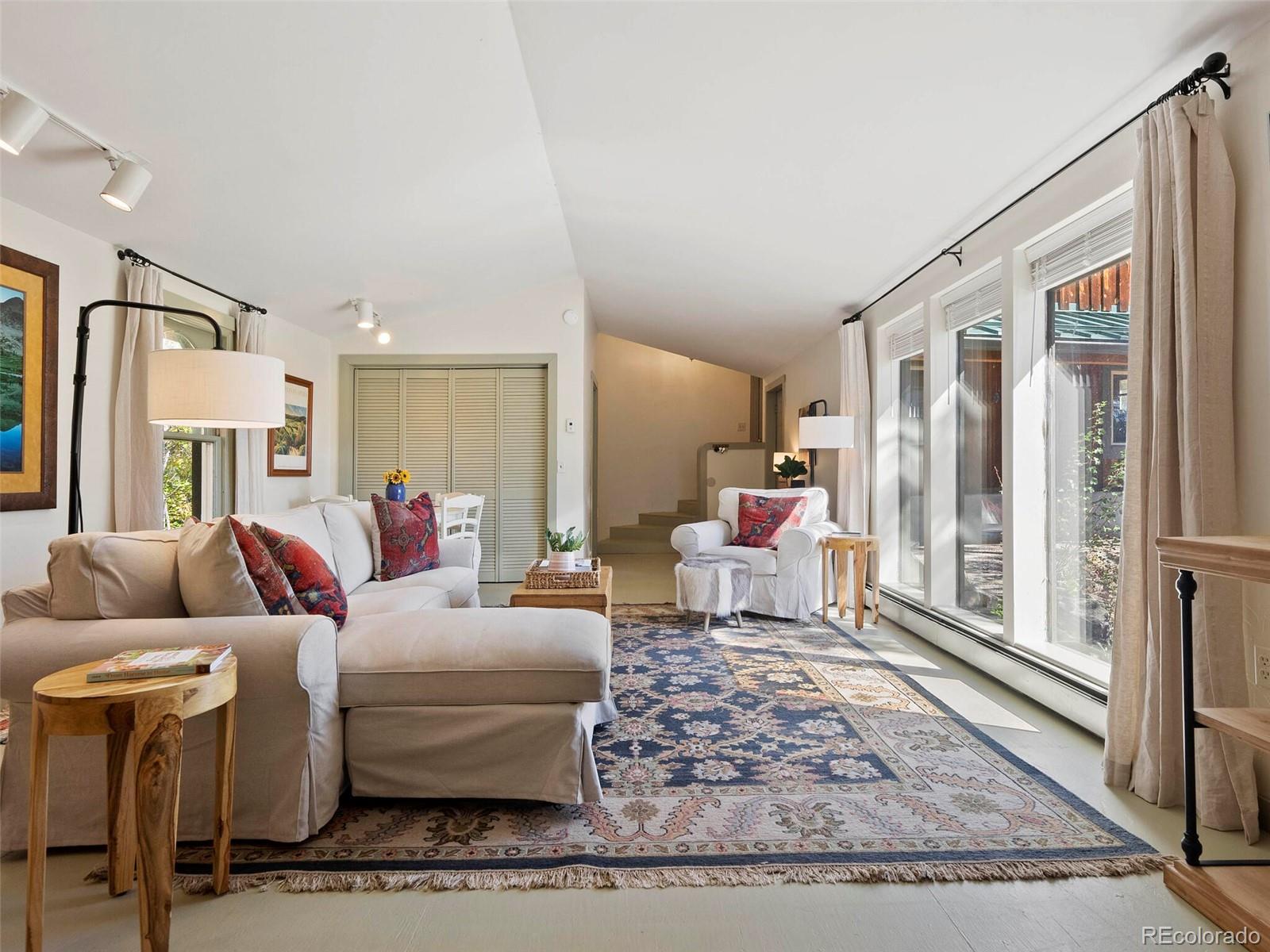 26795 Light Lane Conifer, CO 80433 - Photo 10 of 40 a living room with furniture and a rug