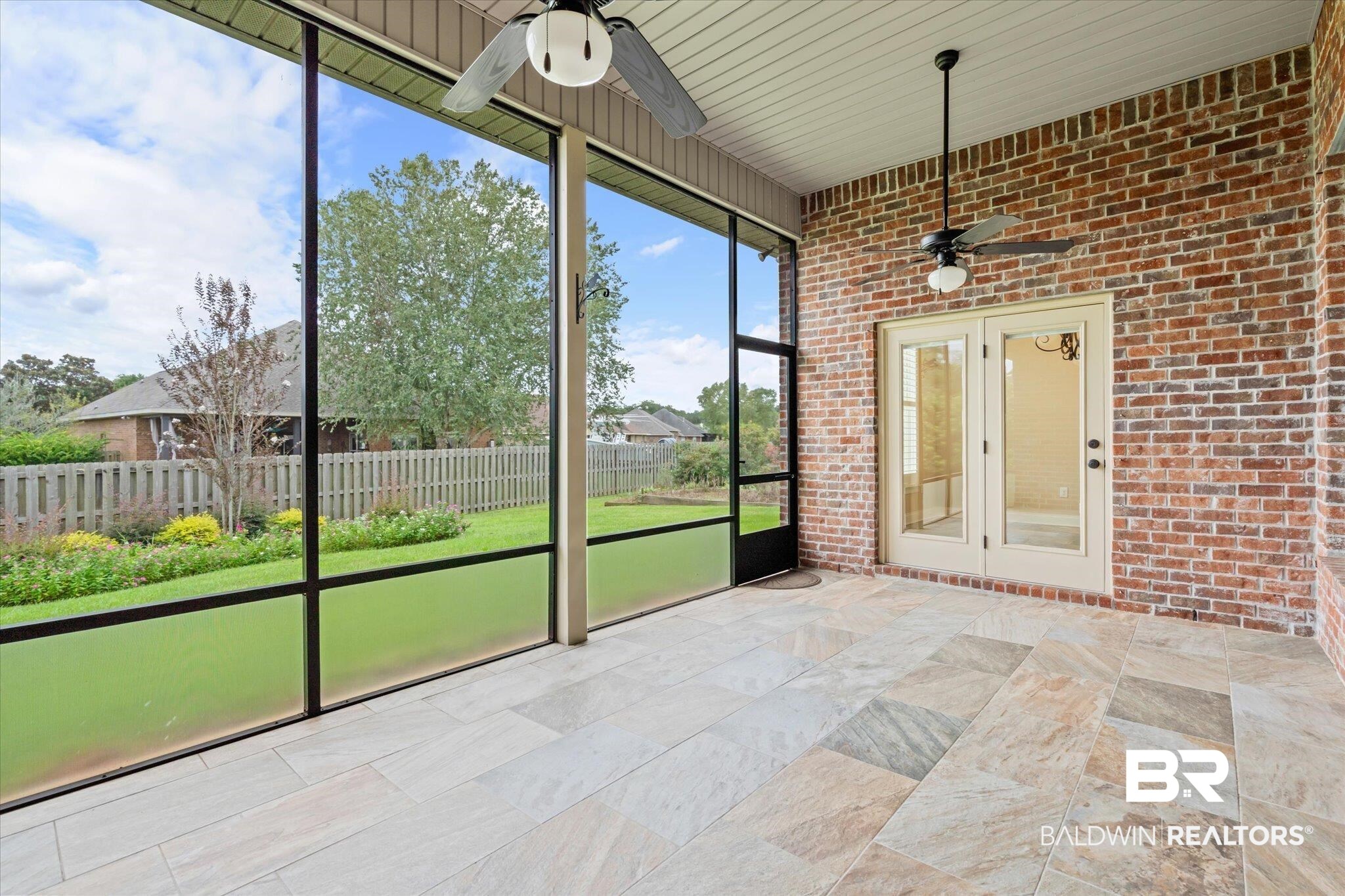 423 Breckin Drive Fairhope, AL 36532 - Photo 7 of 31 Custom tiled screened porch