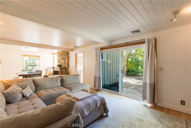 a large kitchen with stainless steel appliances wooden cabinets a sink and a counter top space