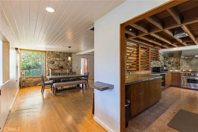 a large kitchen with kitchen island a sink stainless steel appliances and a counter top