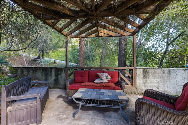 a view of a chairs and table in a patio
