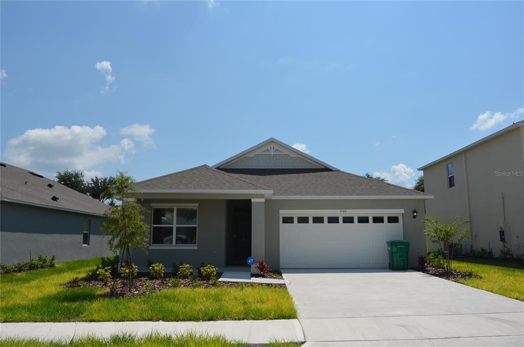 Undisclosed Address Mount Dora, FL 32757 - Photo 1 of 1 a front view of a house with garden
