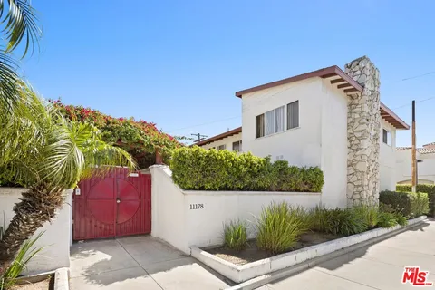 a front view of house with yard outdoor seating and barbeque oven