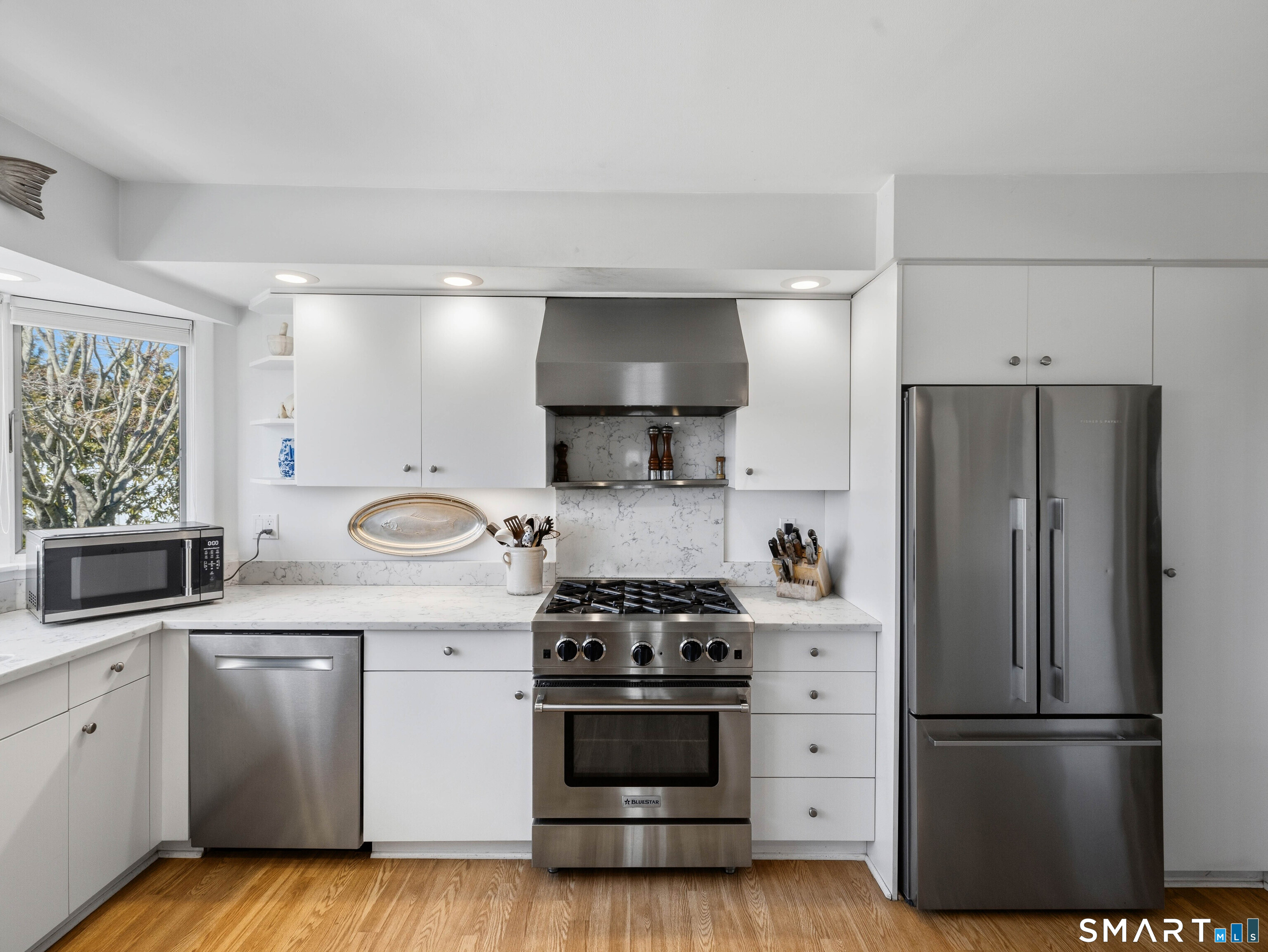 24 Cherry Lane Madison, CT 06443 - Photo 15 of 40 Kitchen with gas stove, stainless appliances and granite countertops