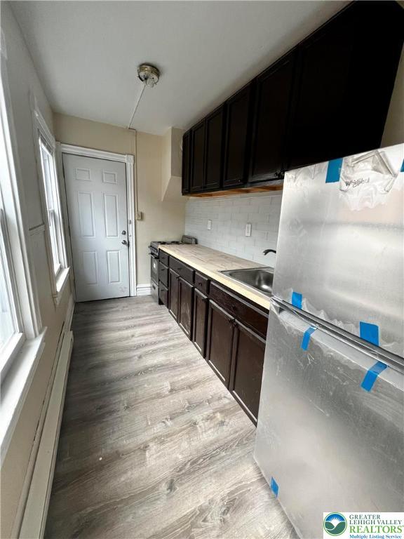 40 North 10th Street, Unit 3 Allentown, PA 18101 - Photo 6 of 19 a kitchen with granite countertop a stove and a refrigerator