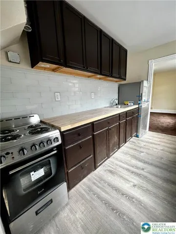 a kitchen with a stove and a sink