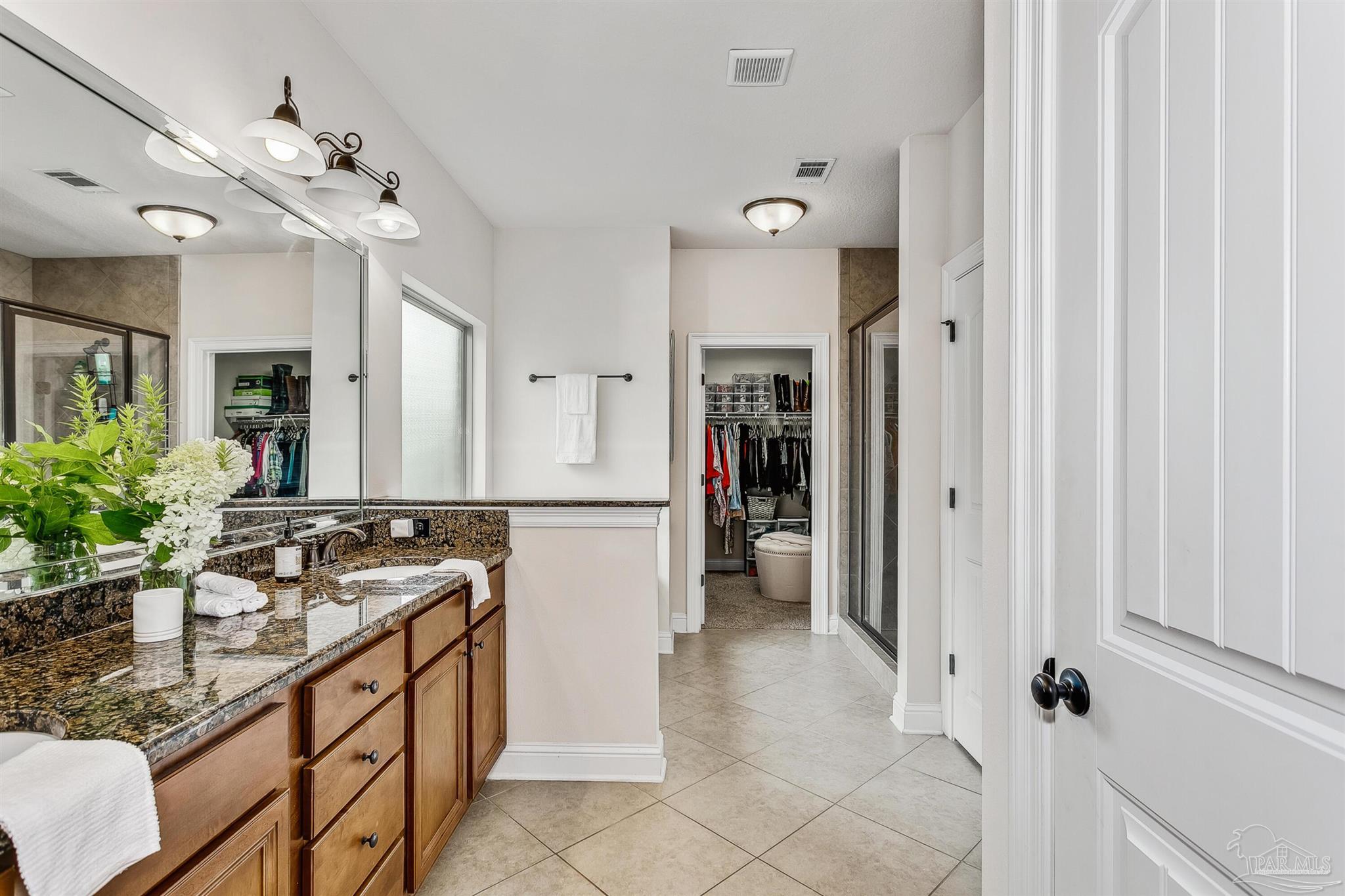 2072 Staff Drive Cantonment, FL 32533 - Photo 23 of 46 a spacious bathroom with a sink double vanity and a mirror
