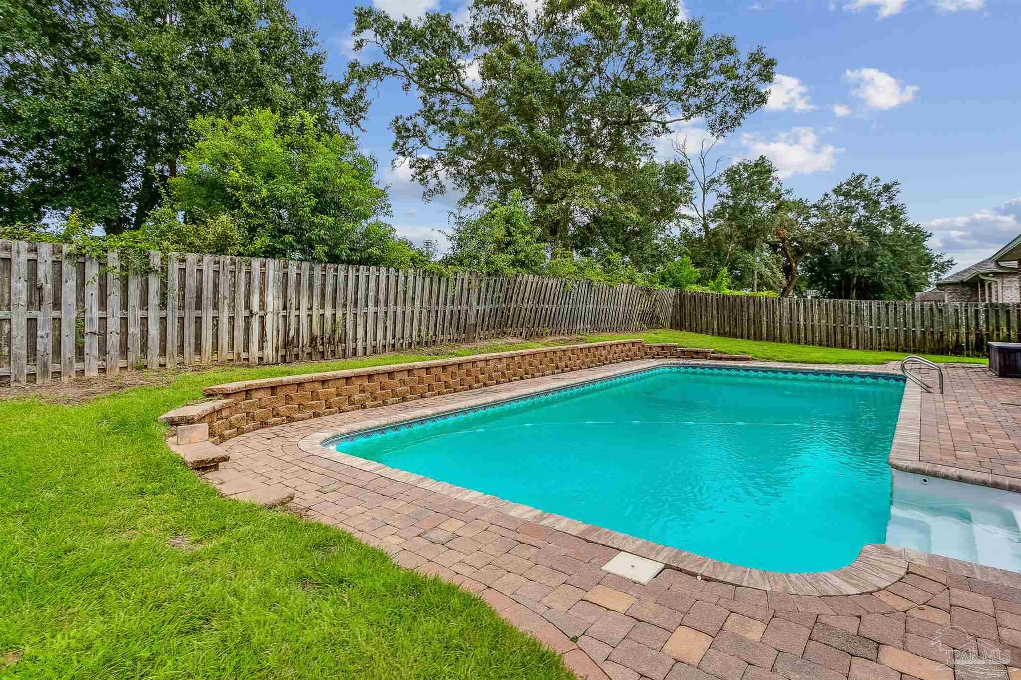 2072 Staff Drive Cantonment, FL 32533 - Photo 41 of 46 a view of a backyard with swimming pool and deck