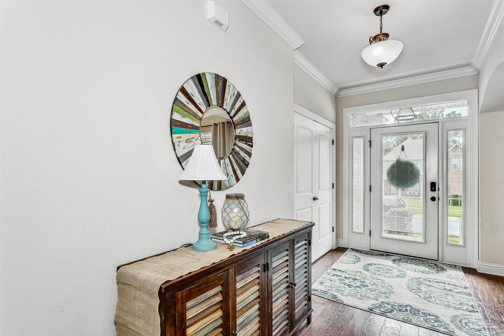 2072 Staff Drive Cantonment, FL 32533 - Photo 5 of 46 a bedroom with a bed and a chandelier