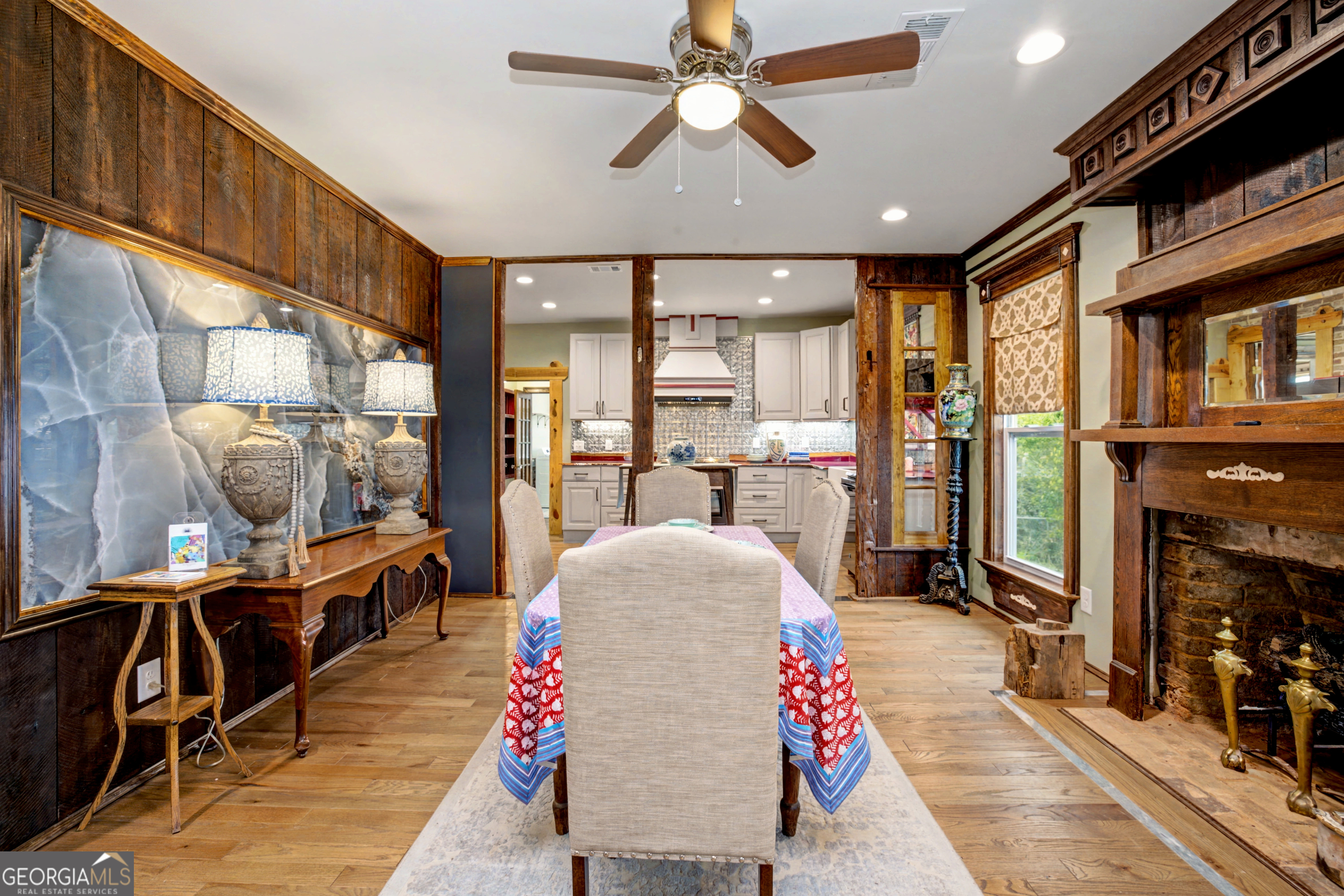 68 Spring Street Newnan, GA 30263 - Photo 12 of 48 a living room with furniture a fireplace and a flat screen tv