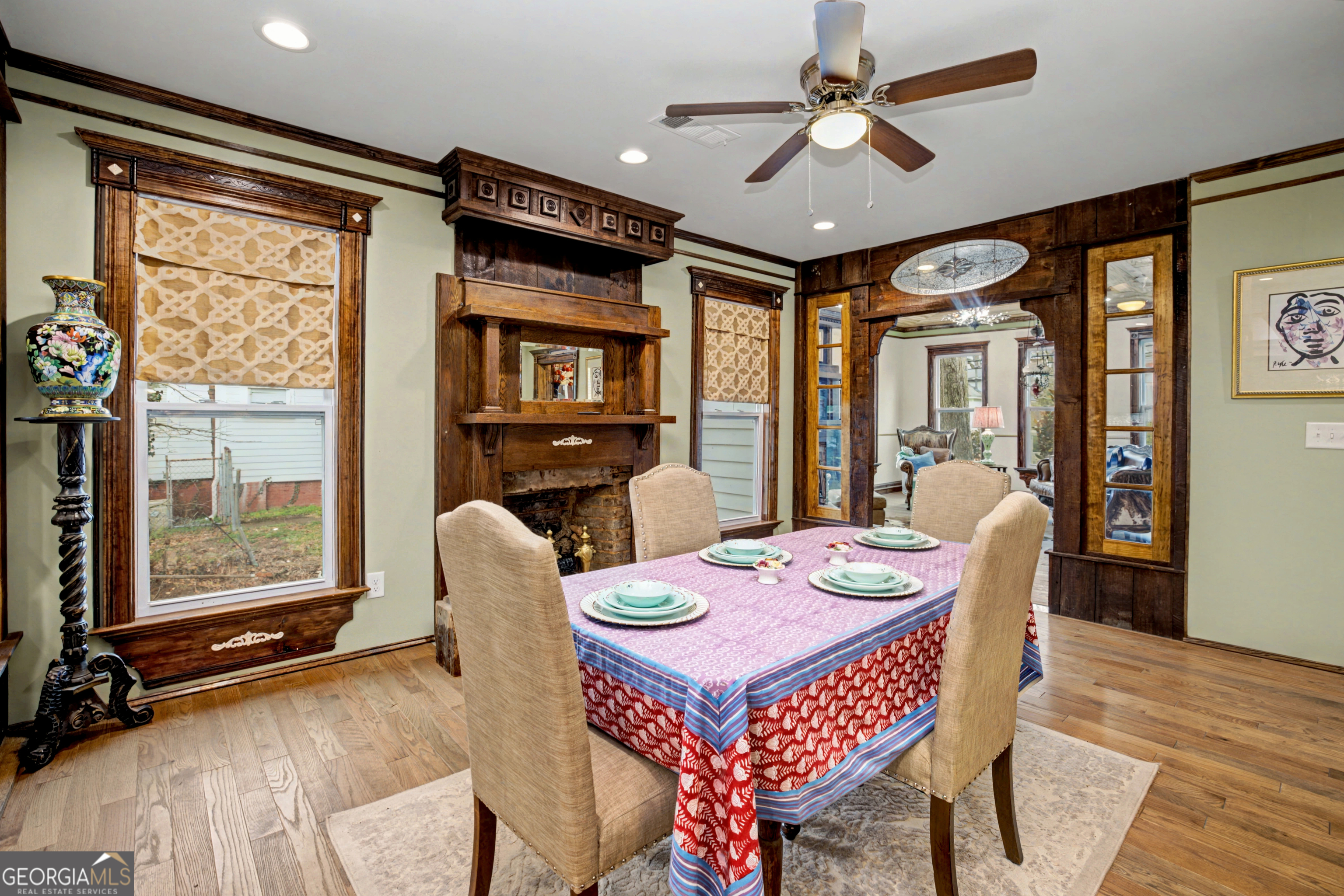 68 Spring Street Newnan, GA 30263 - Photo 14 of 48 a dining room with furniture a chandelier and wooden floor