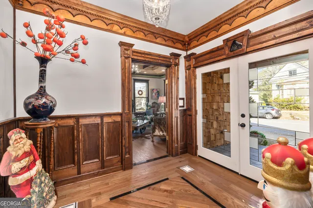 a living room with furniture fireplace and a large window