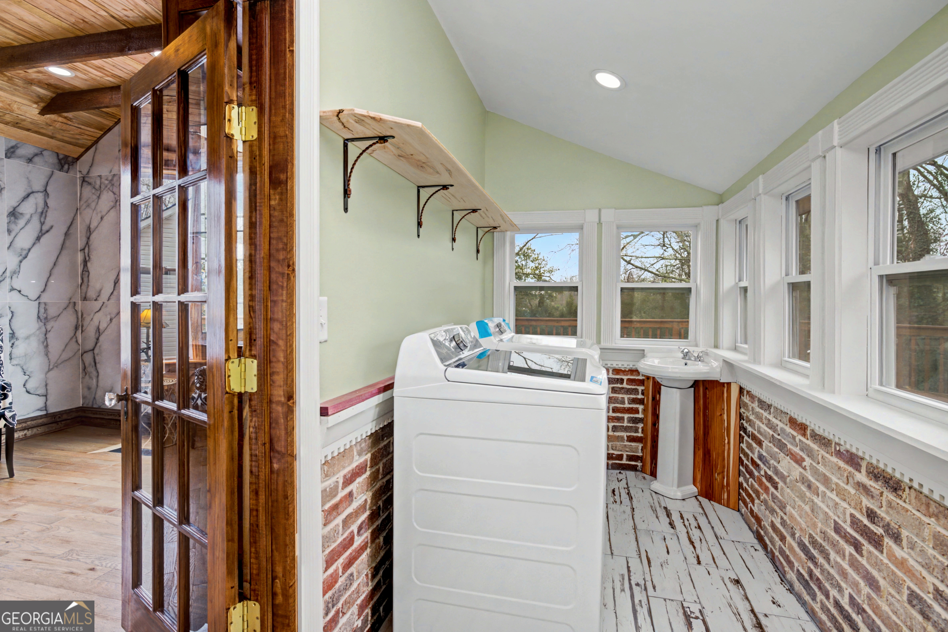 68 Spring Street Newnan, GA 30263 - Photo 21 of 48 a view of walk in closet with clothes and shoes