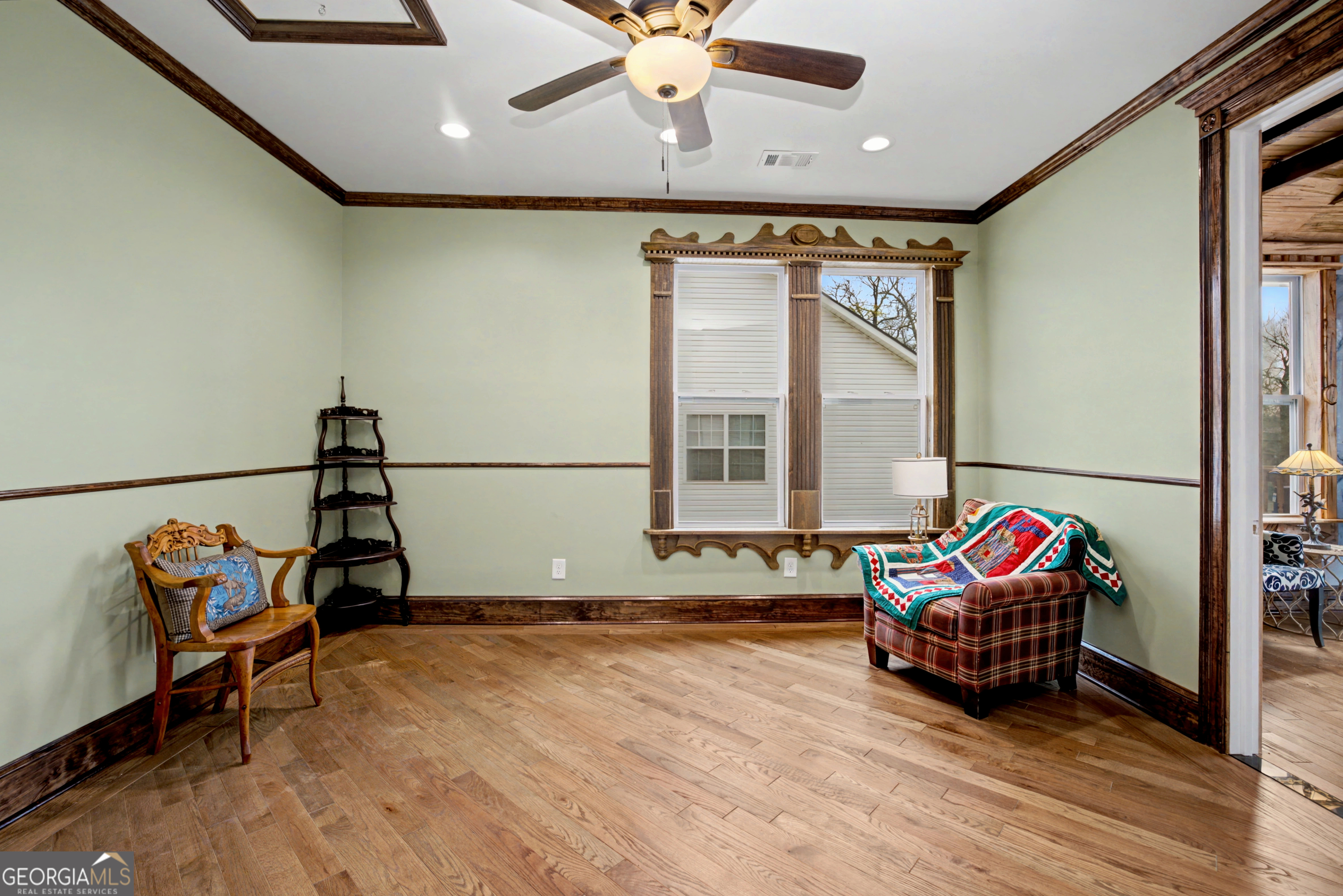 68 Spring Street Newnan, GA 30263 - Photo 25 of 48 a living room with blue lights with furniture and wooden floor