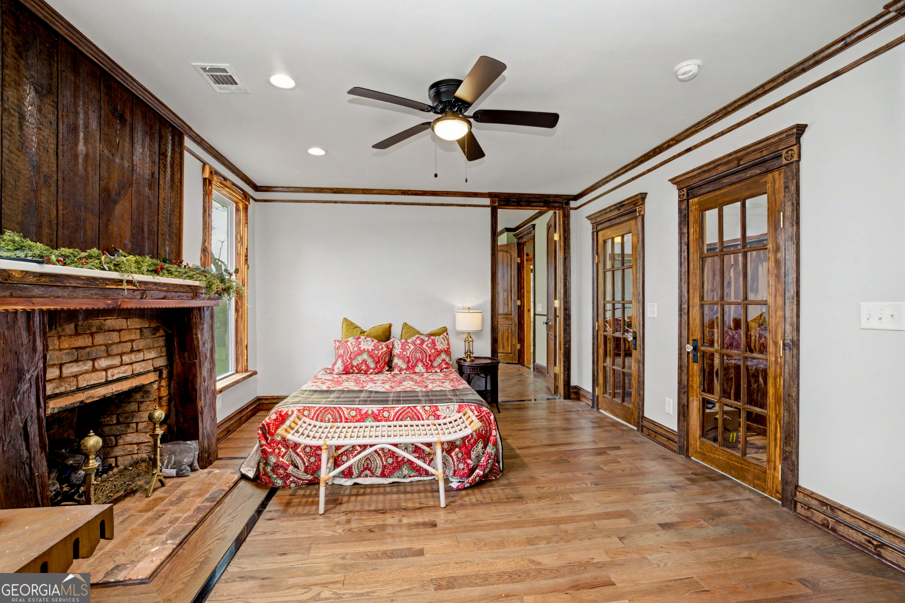 68 Spring Street Newnan, GA 30263 - Photo 29 of 48 a bedroom with furniture and a fireplace