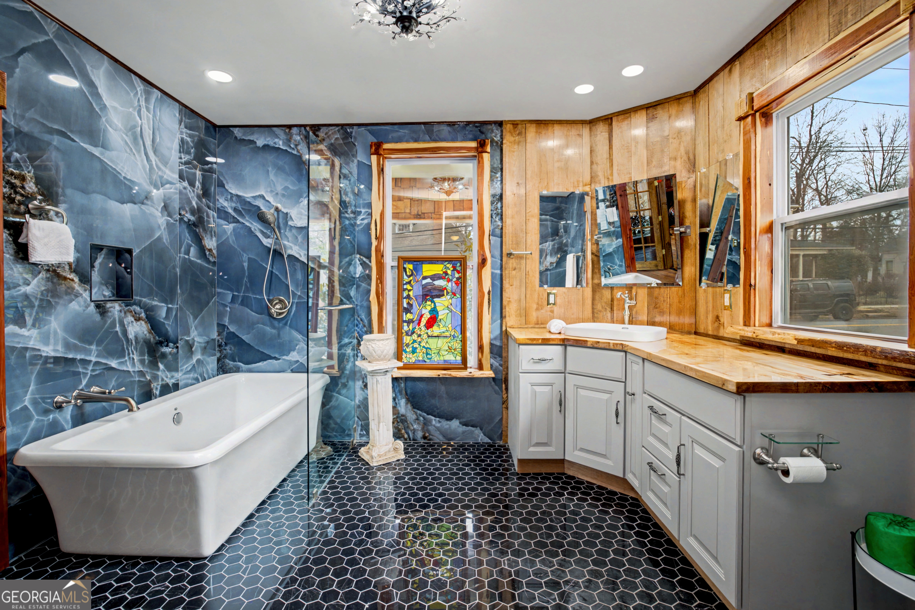 68 Spring Street Newnan, GA 30263 - Photo 31 of 48 a bathroom with a bathtub sink and toilet