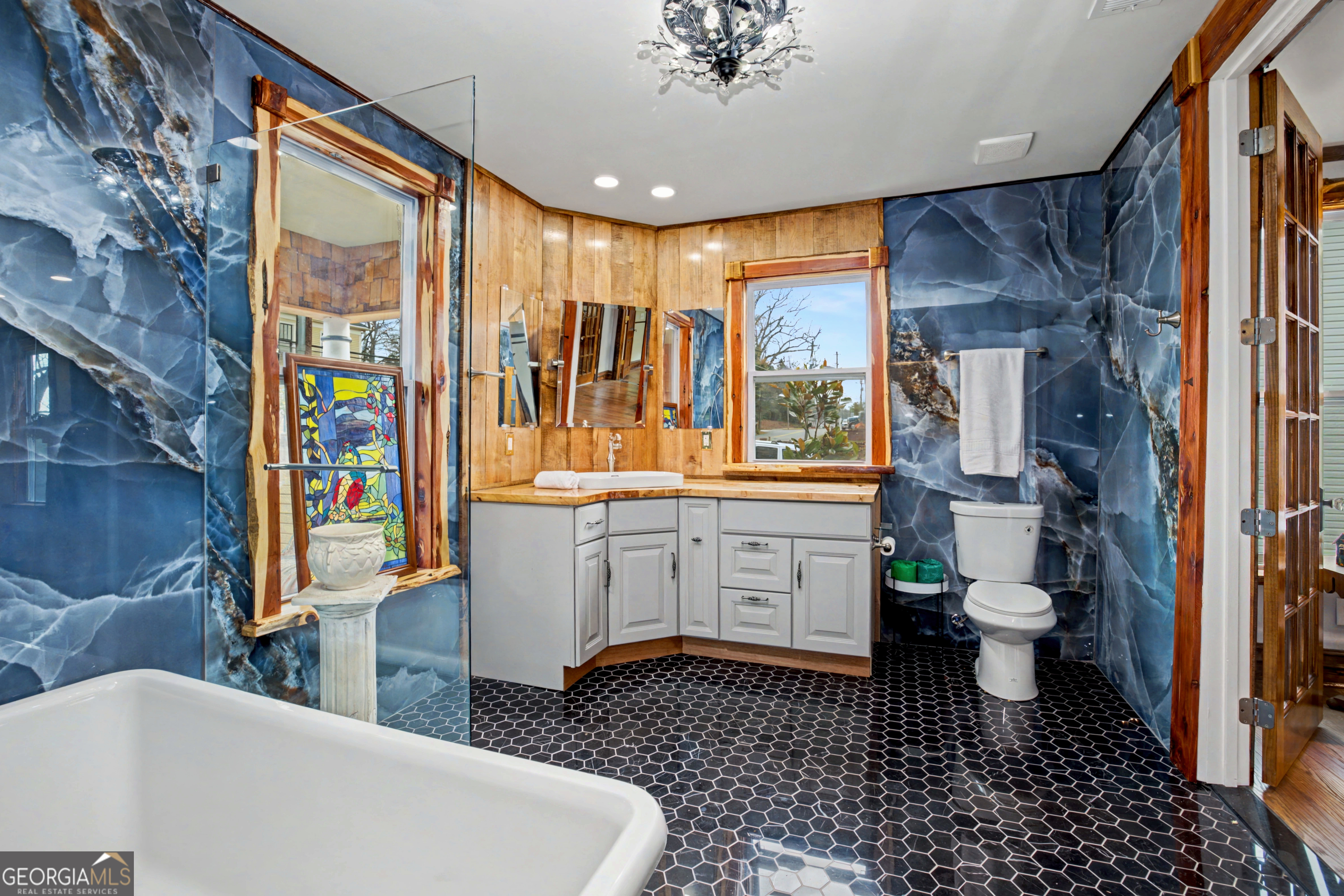 68 Spring Street Newnan, GA 30263 - Photo 32 of 48 a bathroom with a sink a toilet and shower