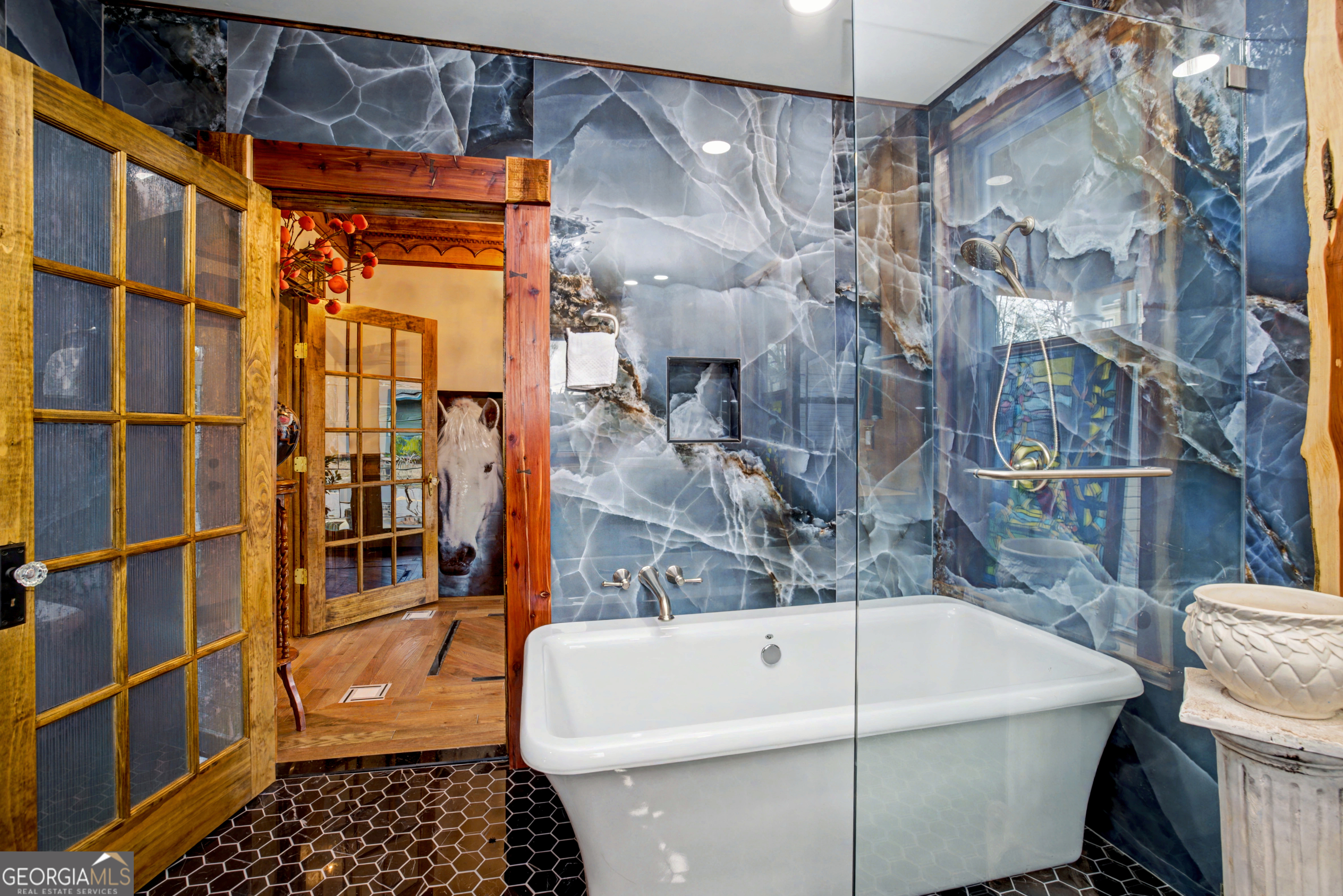 68 Spring Street Newnan, GA 30263 - Photo 33 of 48 a bathroom with a bathtub and shower