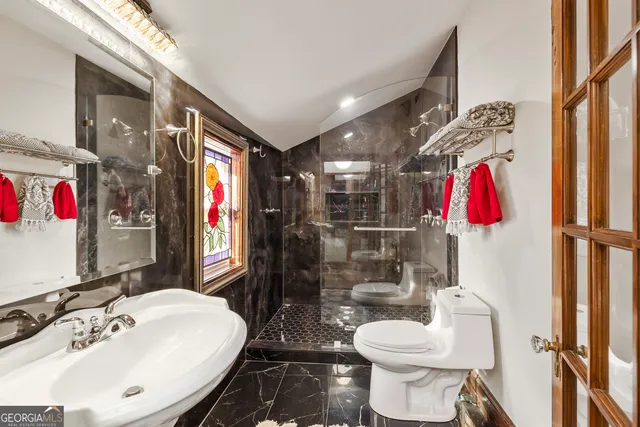 a bedroom with furniture and a window