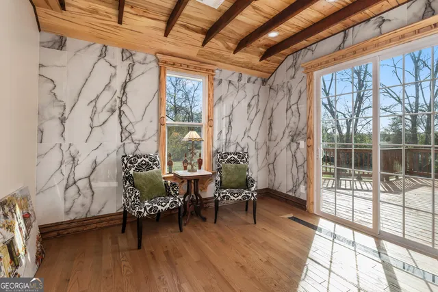 a bedroom with furniture and a fireplace