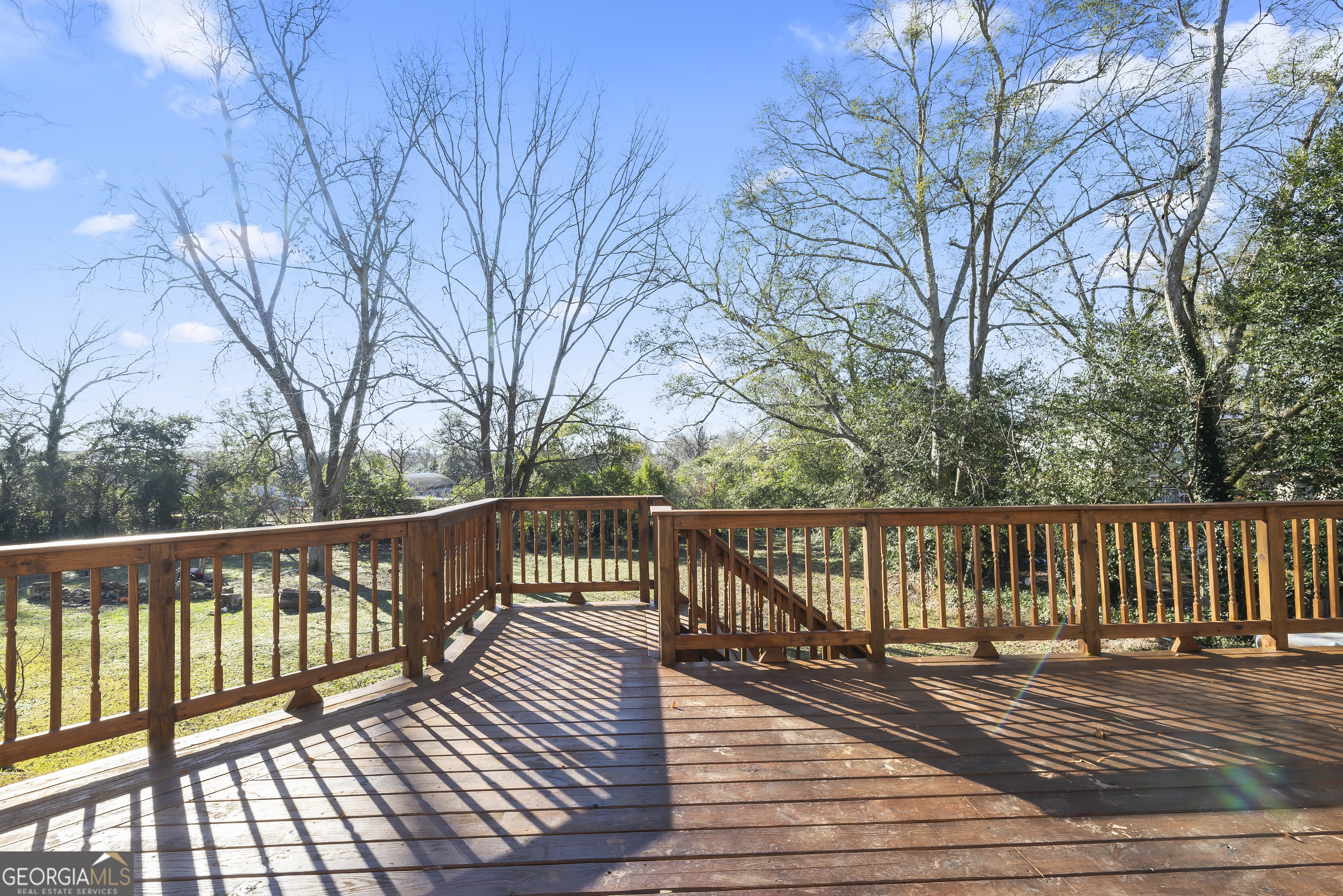 68 Spring Street Newnan, GA 30263 - Photo 42 of 48 a balcony with wooden floor and fence