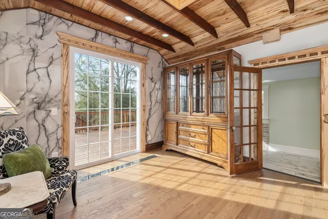 a dining room with furniture and window