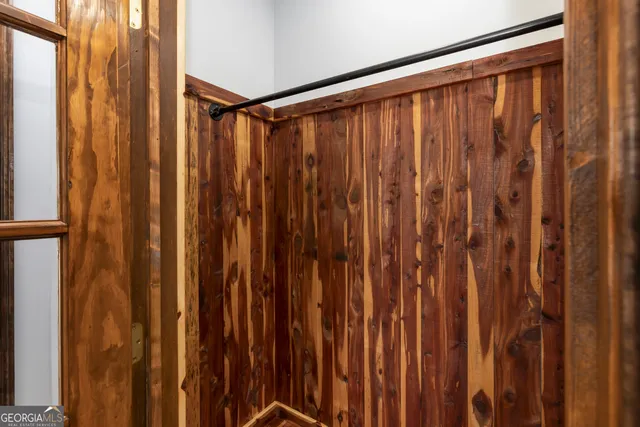 a bathroom with a window and shower