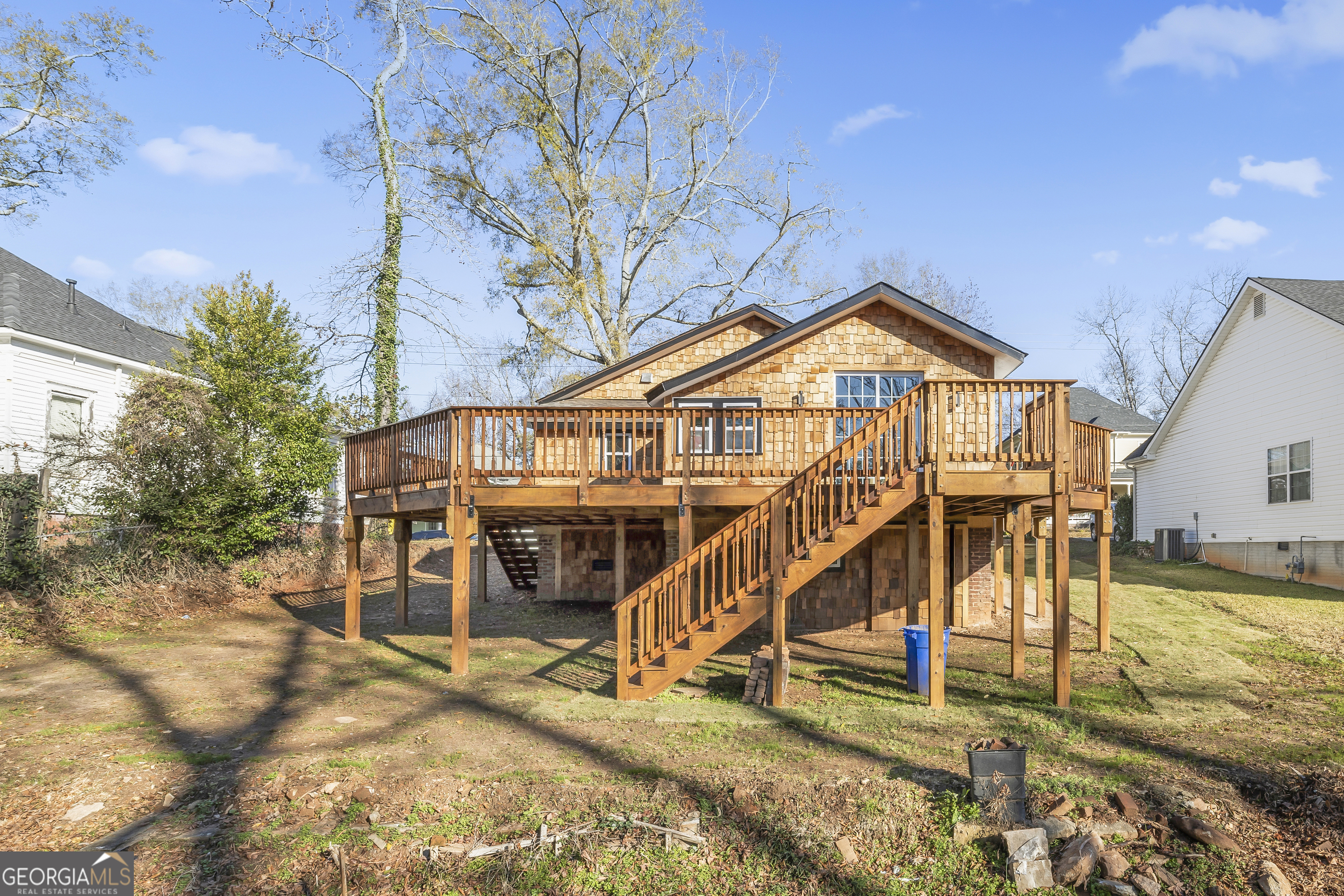 68 Spring Street Newnan, GA 30263 - Photo 6 of 48 a view of a house with a small yard and wooden fence