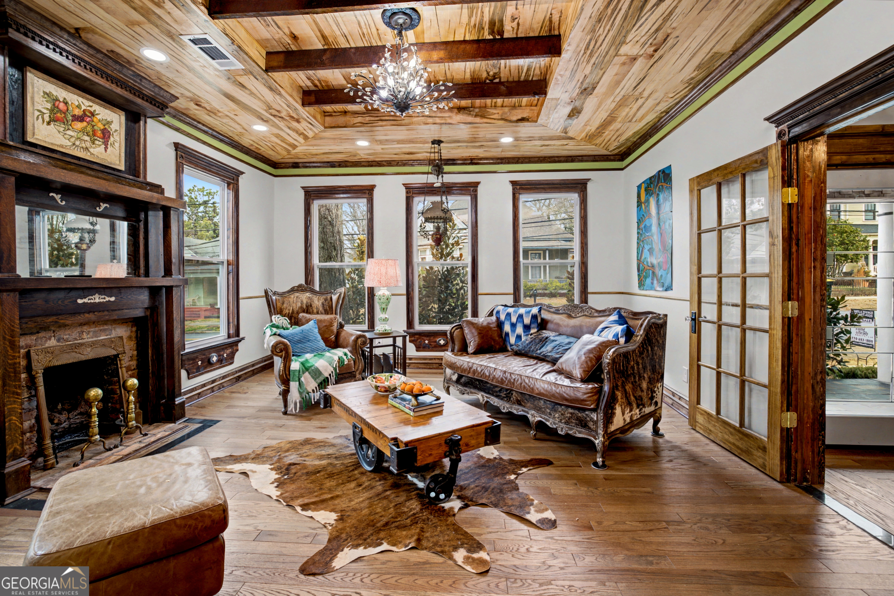 68 Spring Street Newnan, GA 30263 - Photo 9 of 48 a living room with furniture or fireplace and a chandelier