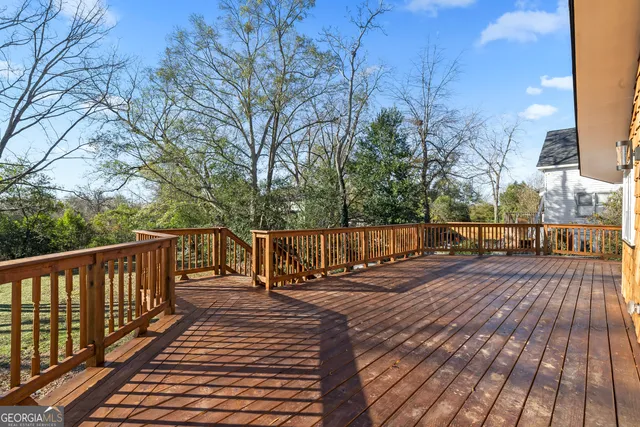 a balcony with wooden floor