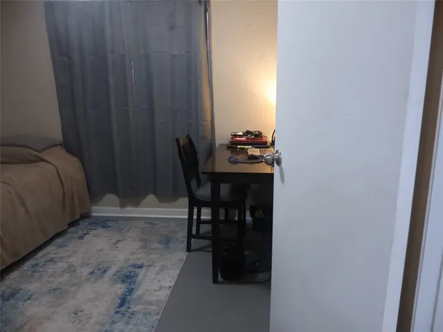 a room with a table and chairs