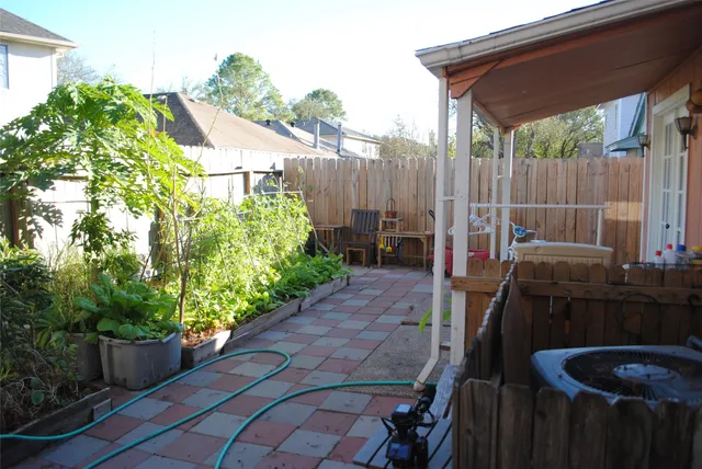 a backyard of a house with yard and outdoor seating