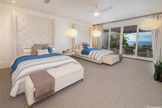 a bedroom with bed and a large window