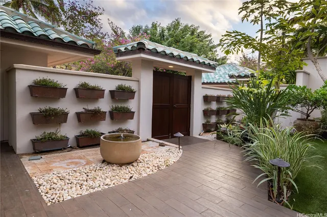 a front view of a house with garden