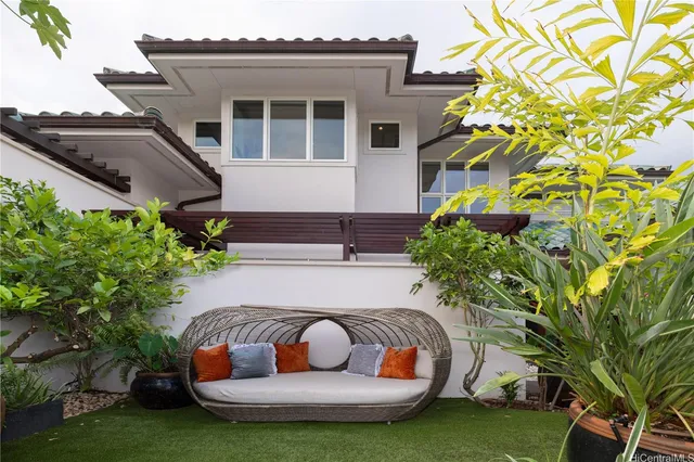 a front view of a house with garden