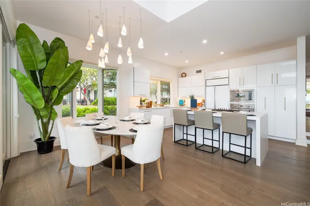 a view of a dining room with furniture window and wooden floor