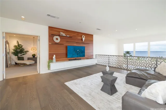 a living room with furniture and a rug