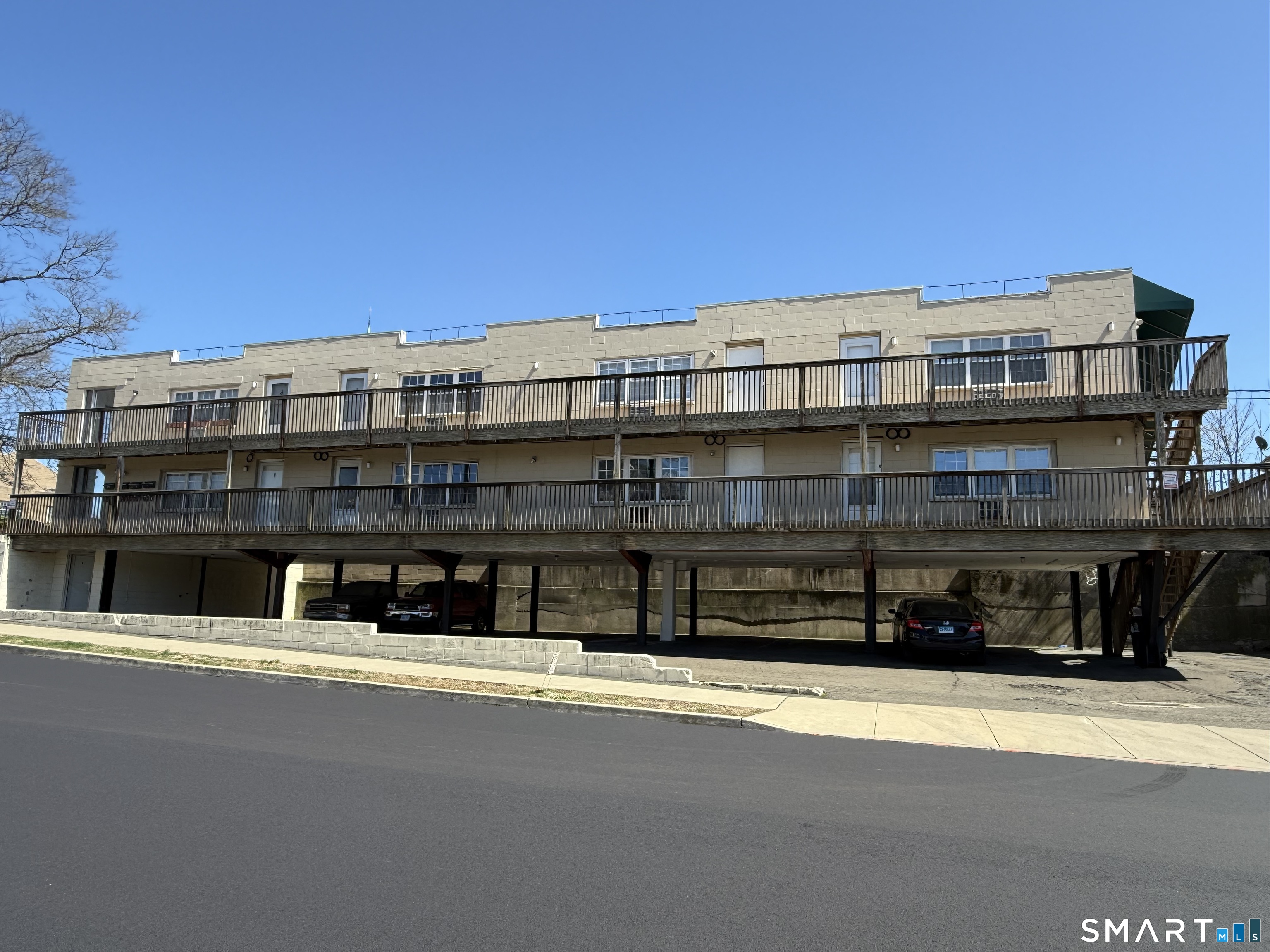 8 Wardwell Street, Unit 5 Stamford, CT 06902 - Photo 13 of 13 a large building with a street