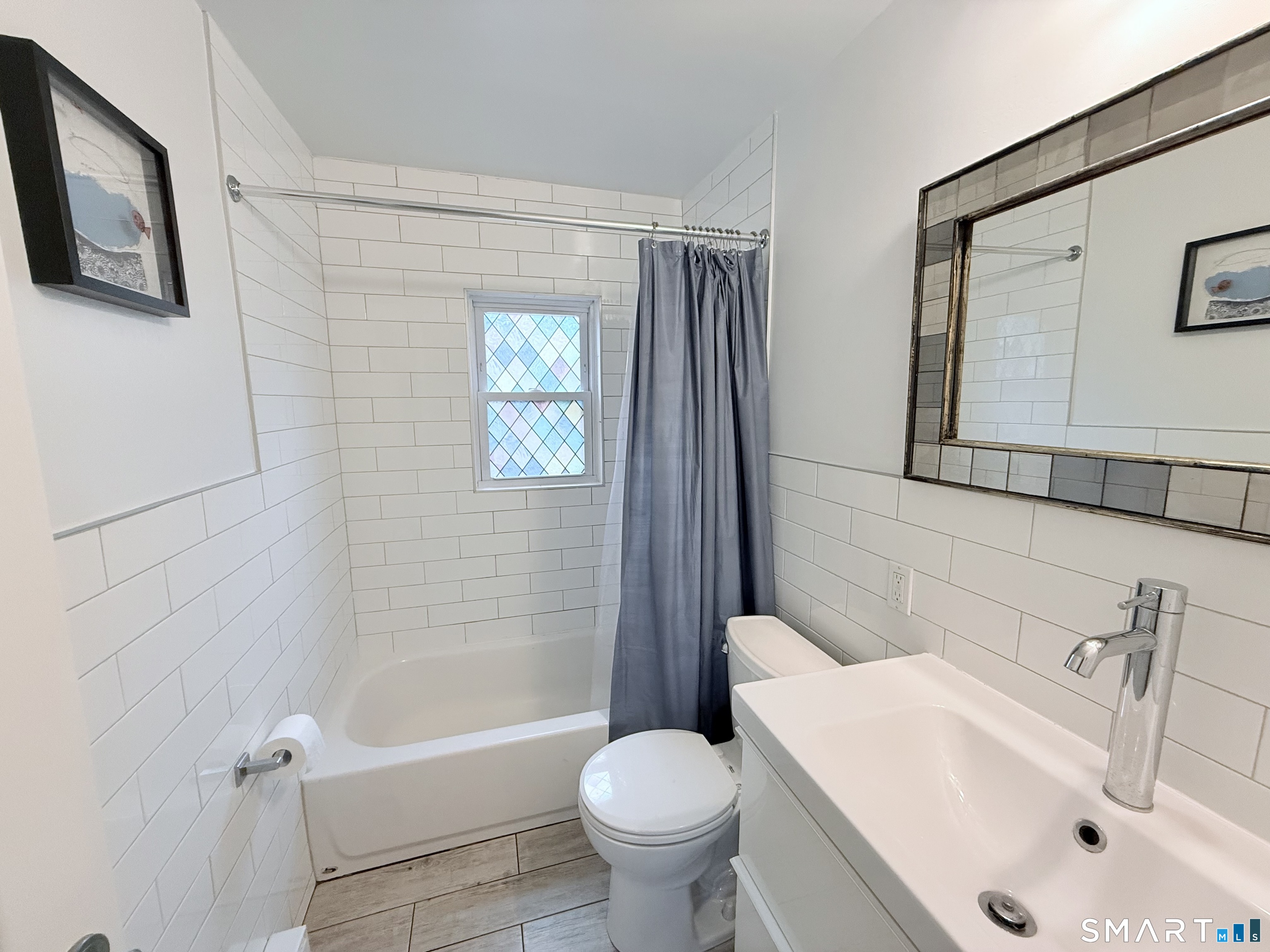 8 Wardwell Street, Unit 5 Stamford, CT 06902 - Photo 10 of 13 a bathroom with a sink toilet and shower