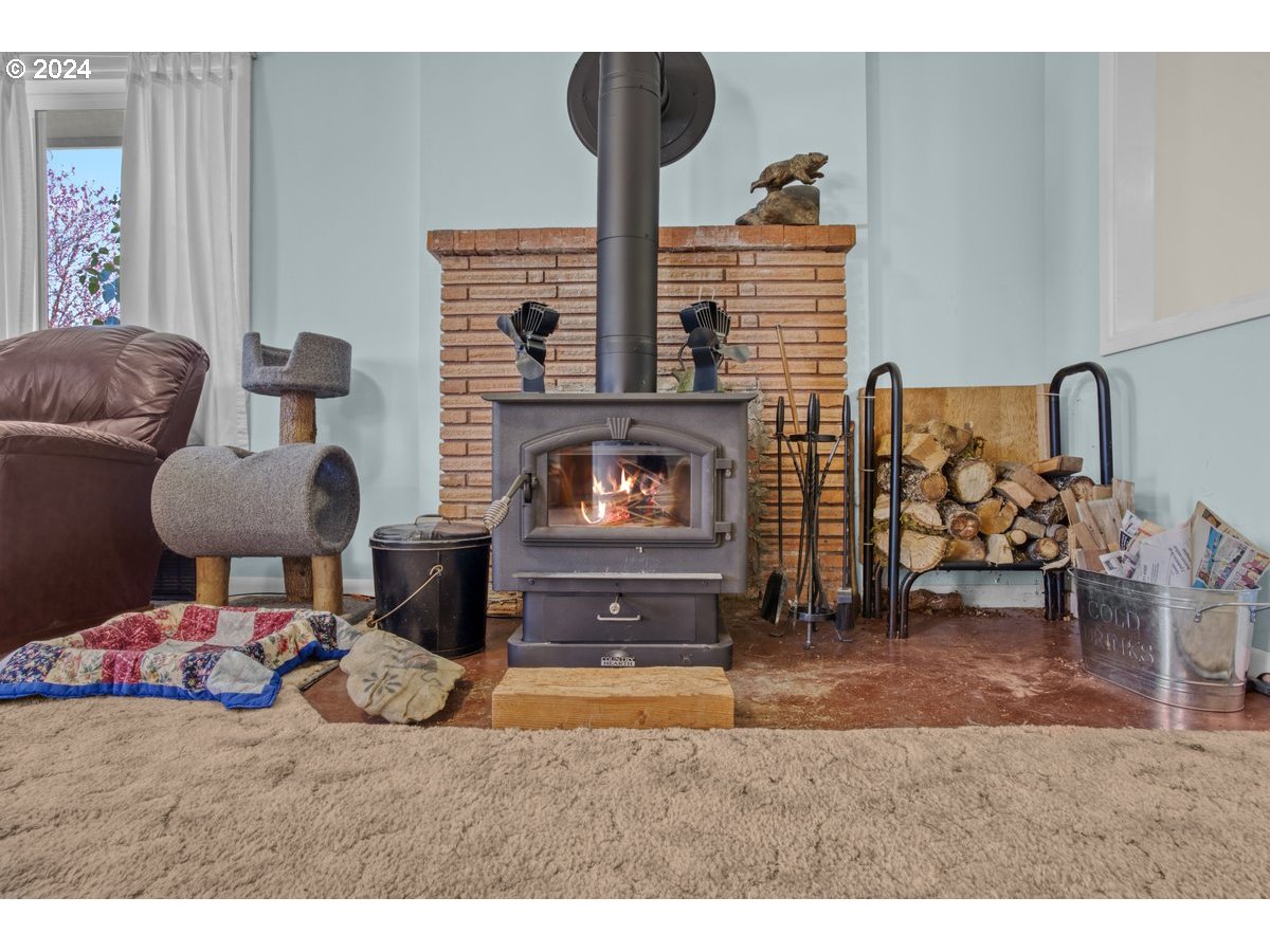 47700 Southwest Hebo Road Grand Ronde, OR 97347 - Photo 6 of 42 a living room with furniture and a fireplace