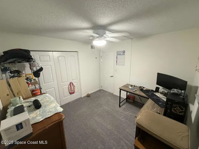 a room with furniture and gym equipment