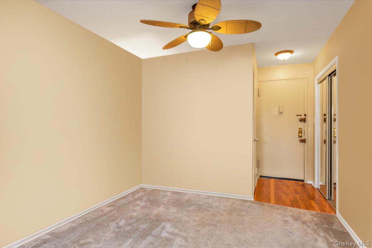 80-35 Springfield Boulevard, Unit 4F Queens, NY 11427 - Photo 14 of 24 Carpeted spare room featuring ceiling fan and baseboards