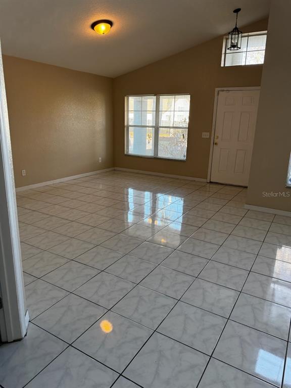 2702 Rochelle Drive Winter Haven, FL 33881 - Photo 2 of 11 a view of empty room with windows