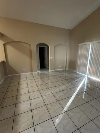 a view of an empty room and window