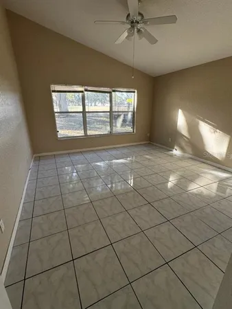 a view of an empty room with a window