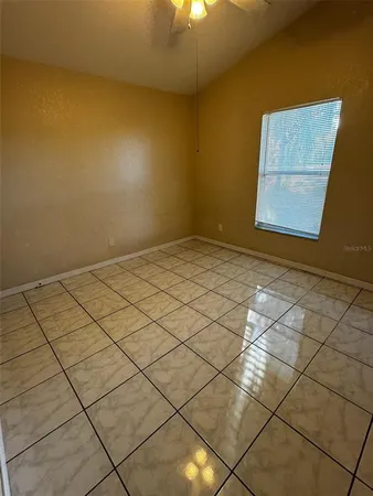 a view of a room with a window and cabinet