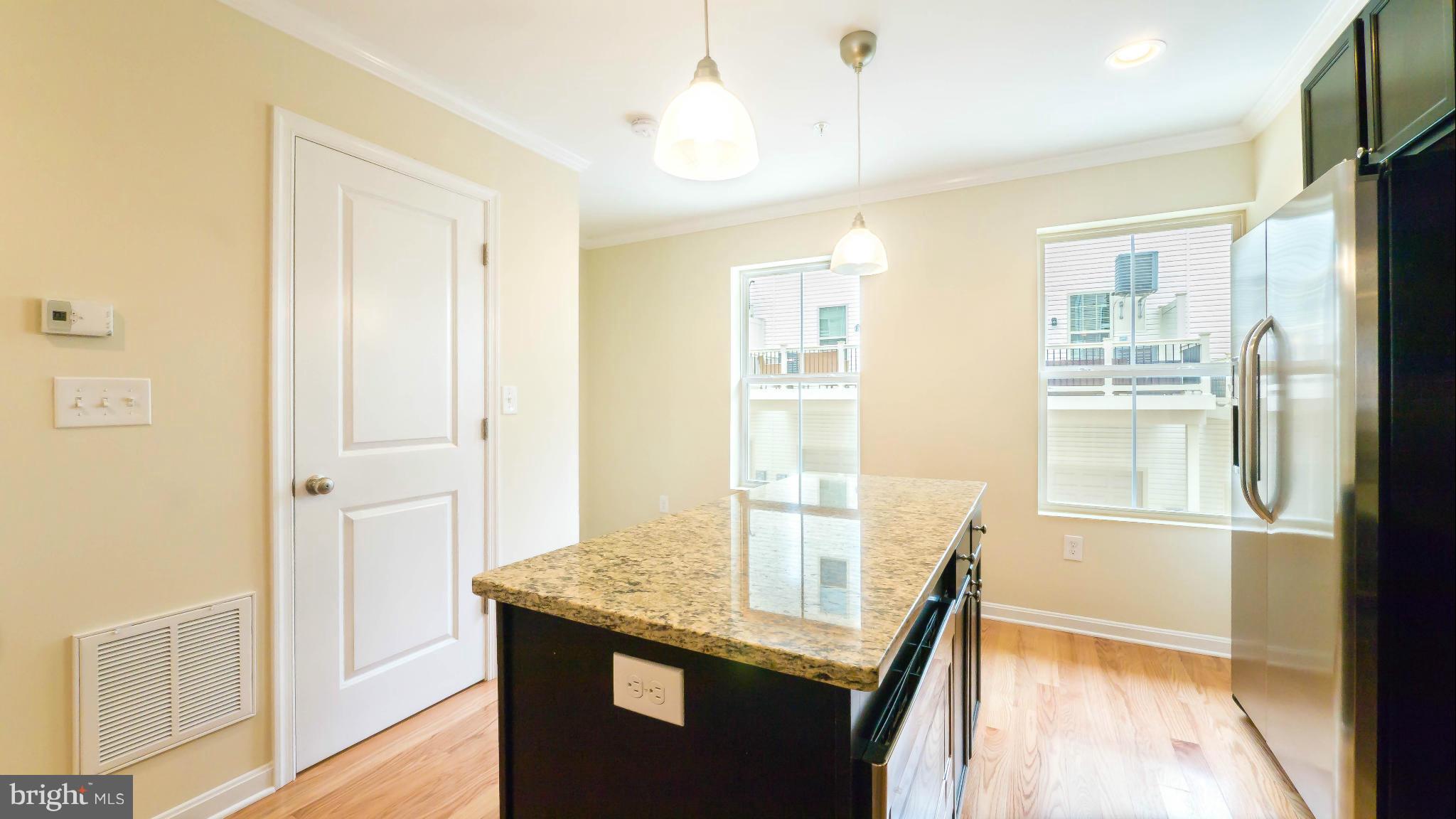 4628 Dillon Place Baltimore, MD 21224 - Photo 6 of 30 a bathroom with a granite countertop sink and a mirror