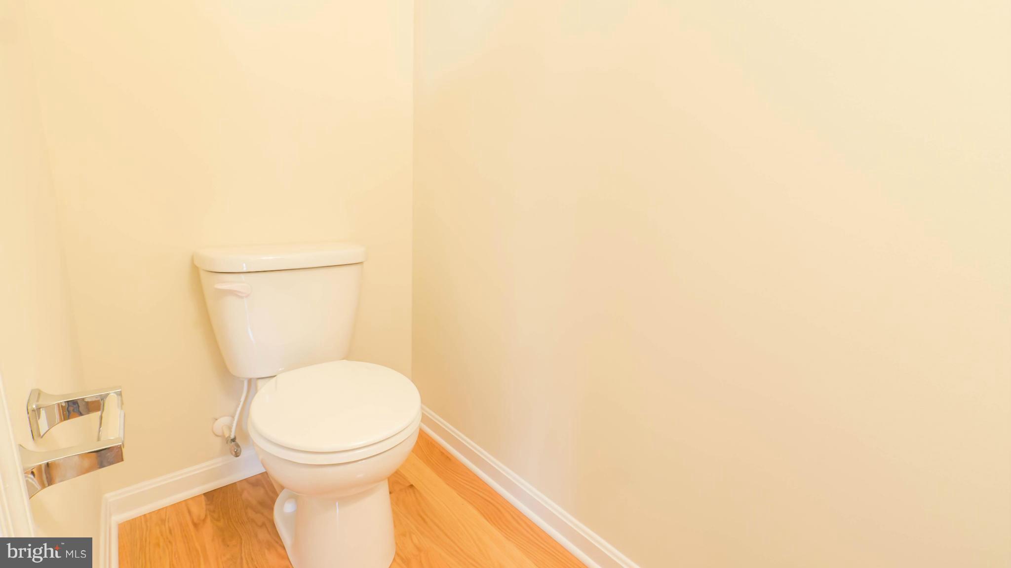 4628 Dillon Place Baltimore, MD 21224 - Photo 7 of 30 a bathroom with a toilet and a vanity